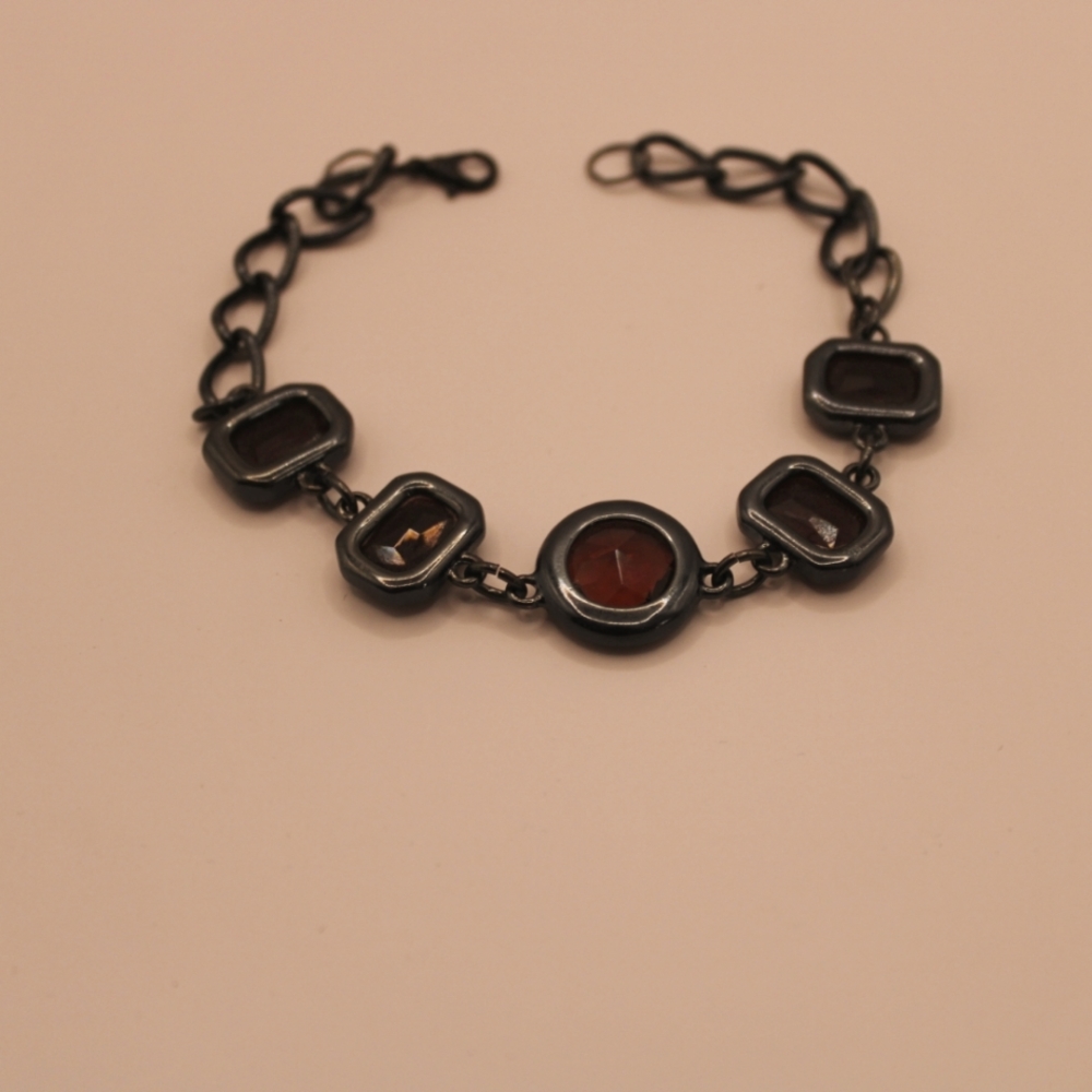 Bracelet with purple glass.